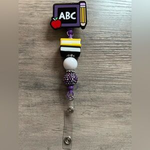Teacher badge reel